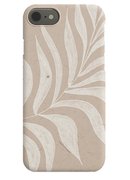 – Hvitt og beige iPhone-deksel med et hvitt blad mot en beige bakgrunn