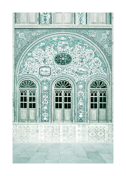 Fotografi av mintfarget fasade med mosaikkmønster og mintfargede dører