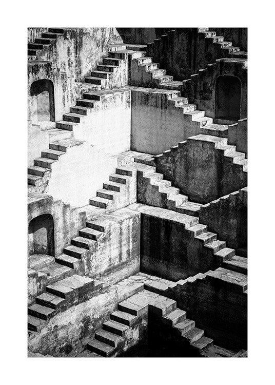  - Svarthvitt-fotografi av vegger med trapper ved siden av