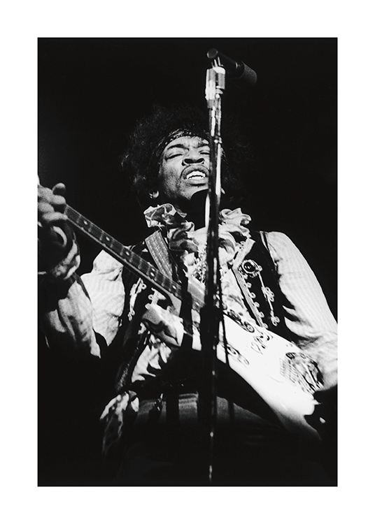 – Svarthvitt-fotografi av musikeren Jimi Hendrix som spiller gitar